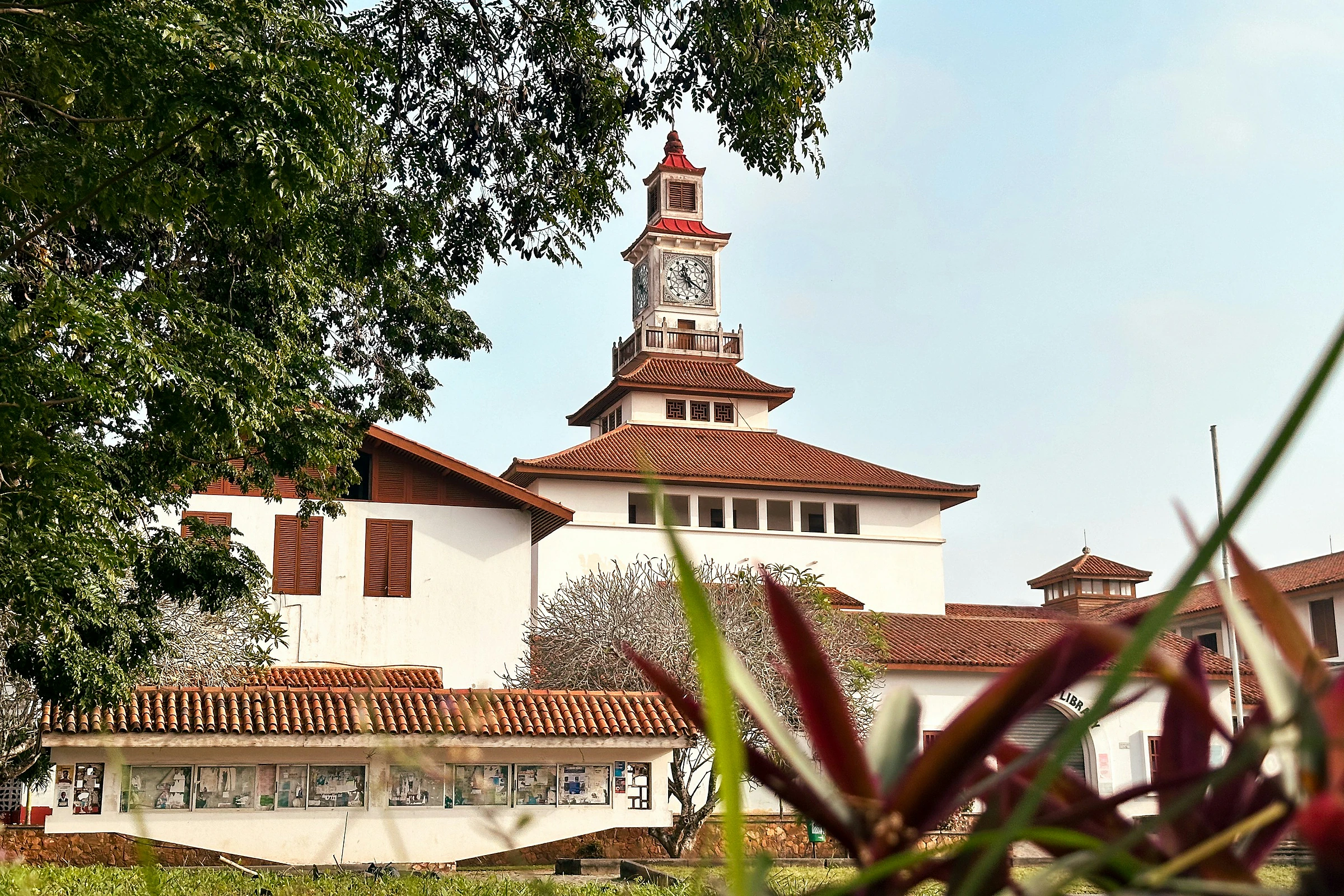 Documentary photograph of a university clock tower and campus architecture